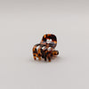 Kleine Haarspange in Amber-Optik mit Herzdetail, Vorderansicht