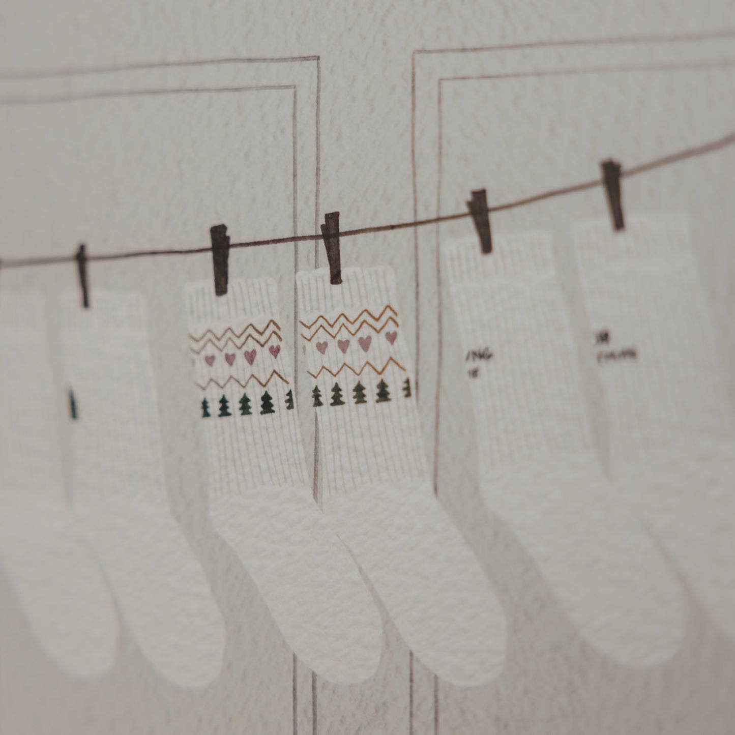 Weihnachtliche Socken als Illustration auf dem Eulenschnitt Socken-Adventskalender für Paare