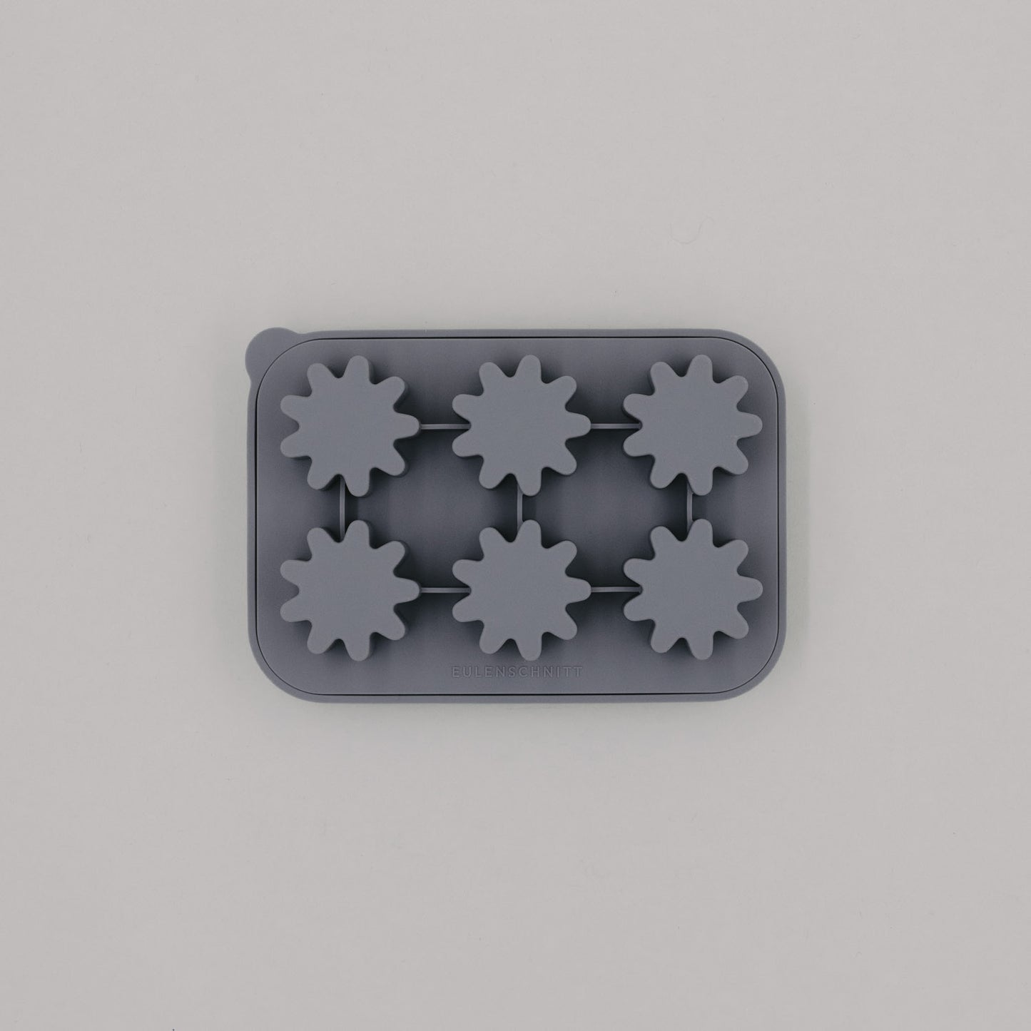 Eiswürfelform in Grau mit sechs Blütenformen aus flexiblem Silikon.
