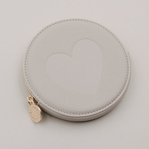 Rundes Portemonnaie in Creme mit Herzmotiv und goldenem Reißverschluss