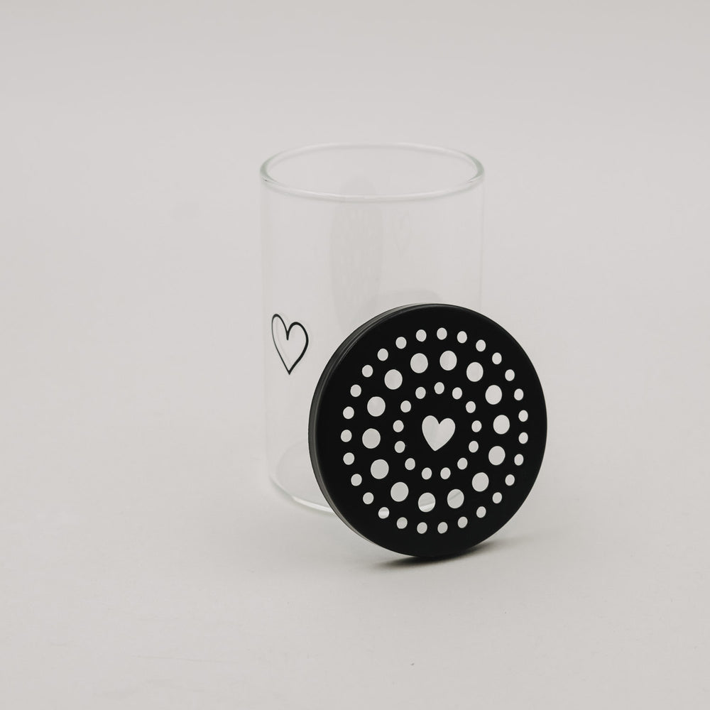 Mini-Blumenhalter aus Glas mit abgenommenem schwarzem Herz-Lochdeckel, minimalistisches Eulenschnitt-Design.
