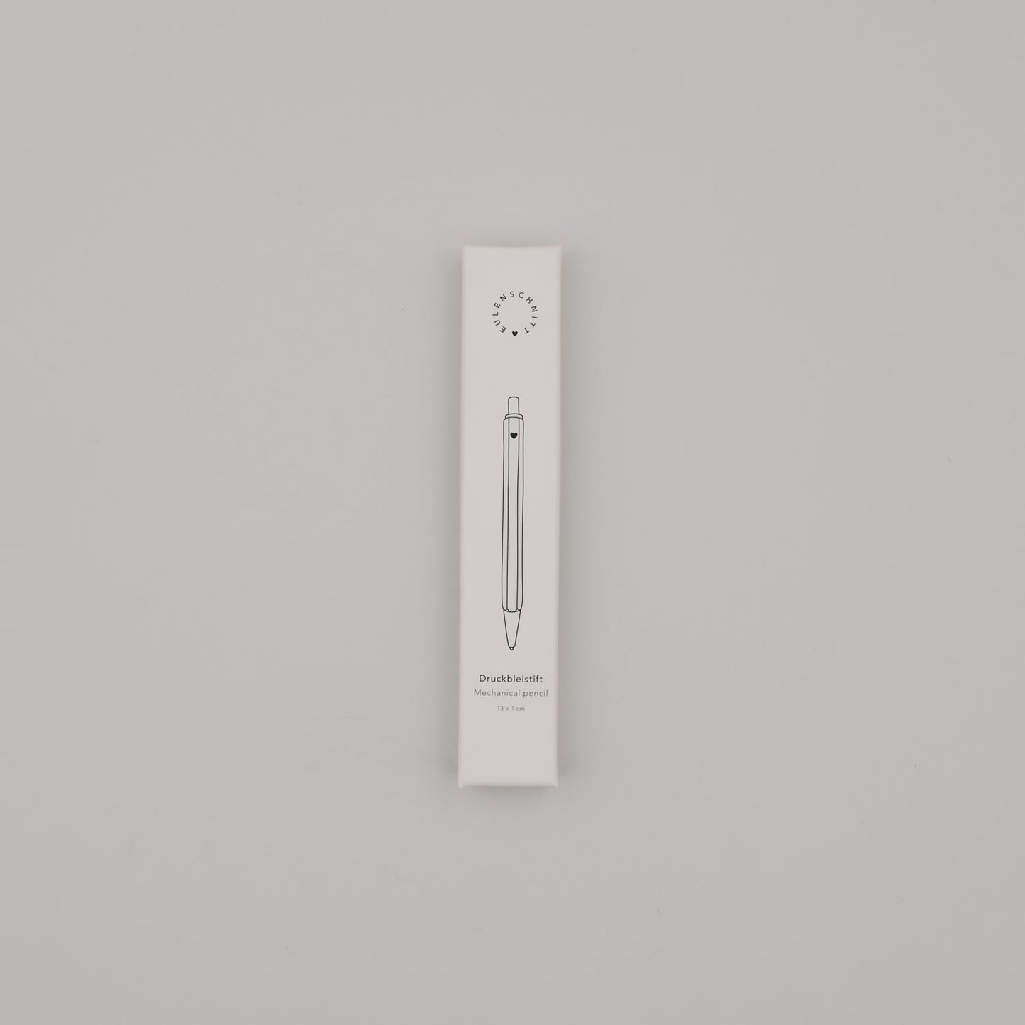 Verpackung des cremefarbenen Druckbleistifts mit minimalistischer Illustration