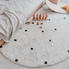 Tapis tissée rond à pois 